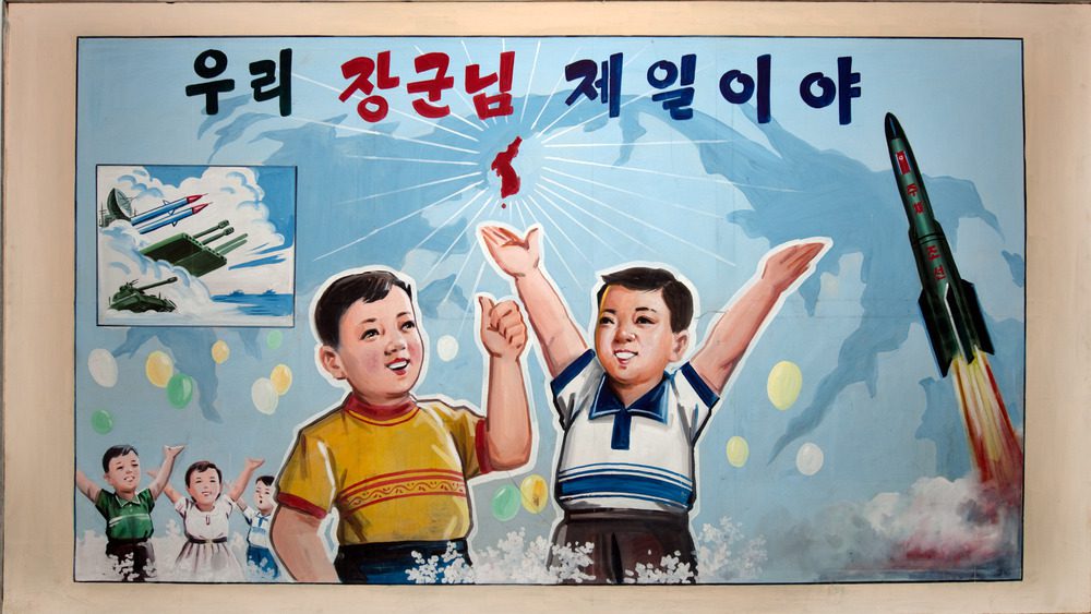Плакат с изображением молодых парней среди ракет