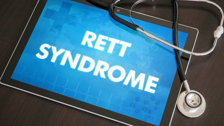 знак, предупреждающий о синдроме Ретта