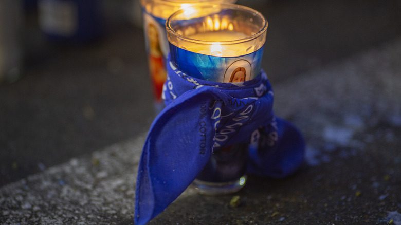 blue bandana tied around candle
