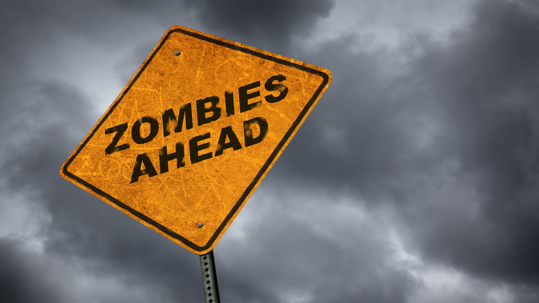 Дорожный знак, предупреждающий о зомби